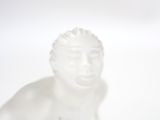 a white statue of a man with his eyes closed