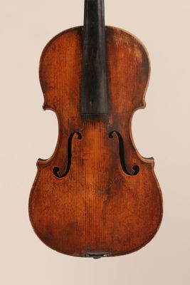 an old violin with a bow on a white background