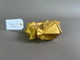 a gold origami piece with a price tag on it
