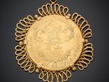 a gold coin pendant with a design on it
