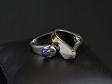a close up of a silver ring with a lapis stone on it