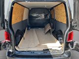 the back of a van with a mattress in the back of it