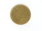 an image of a gold coin sitting on top of a white surface
