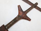 two old tools that are laying on a white surface