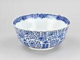 blue and white porcelain bowl with floral design on the rim