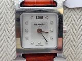 an image of a close up of a wrist watch with a price tag on it