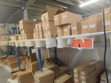 many boxes on the shelves in the warehouse