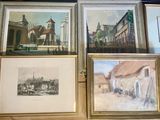 four framed pictures on the wall of a room