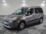 the silver van is parked on a checkered floor in a garage