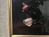 a painting of flowers in a vase on the wall