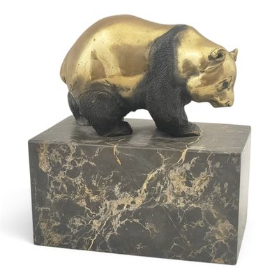 statue of a bear on a marble base on a white background