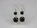 black onyx beaded earrings on clear acrylic stand