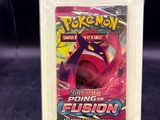 a close up of a box of pokemon cards on a table