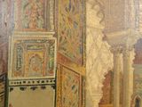 a painting on the wall of a building with columns and arches