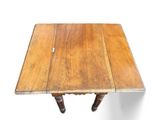 a wooden table with two legs and a table top on it