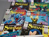 a lot of comic books sitting on a table
