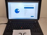un ordinateur portable dont l'écran affiche le chiffre 26