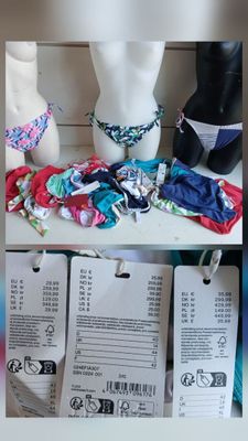 many different types of bikinis on display in a store