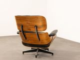 the chair is made of wood and black leather