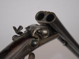 a close up of a gun that is on display