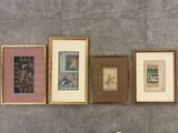 four framed pictures on the wall next to a toilet