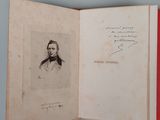 an open book with a picture of a man in a suit on it