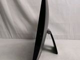 a black computer monitor on a stand on a white background