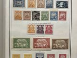 an open book with a bunch of different stamps on it
