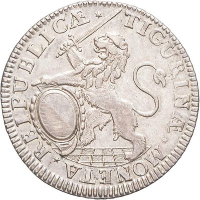 a close up of a silver coin with a lion on it