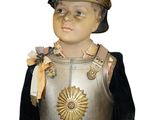a statue of a man wearing a helmet and red pants