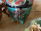 three vases that are sitting on a table