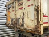 an image of a dump truck parked in front of a building