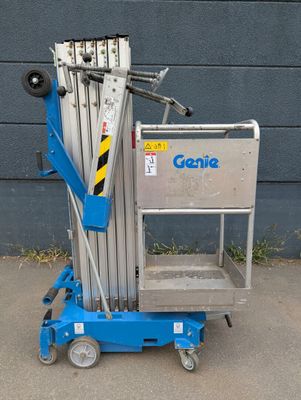 a small blue scissor sitting on top of a blue cart