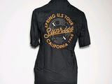 a black shirt with a logo on it on a mannequin