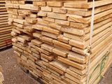several stacks of wooden planks stacked on top of each other
