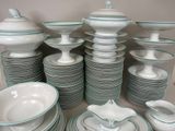 a lot of plates and bowls that are stacked together