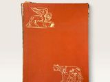 an orange book with a drawing of a man and a dog