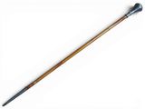 a close up of a cane with a wooden handle on a white surface