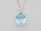 a blue topaz quartz and diamond pendant on a chain