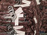 many pairs of scissors that are on a table