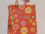 a small bag with a bow on it on a table
