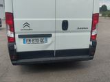 a white van that is parked in a parking lot