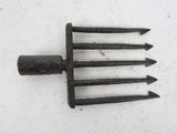 a small metal fork with four forks attached to it