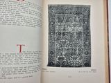an open book with a black and white drawing of a tree
