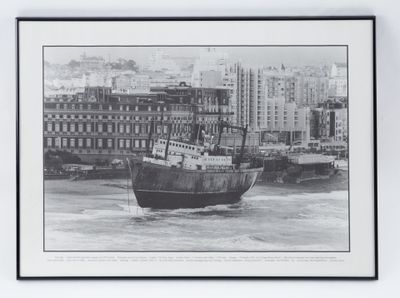 a black and white photo of a boat in the water