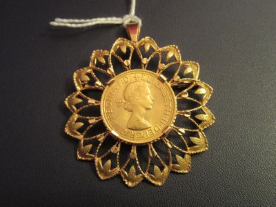 an image of a gold coin is hanging from a string