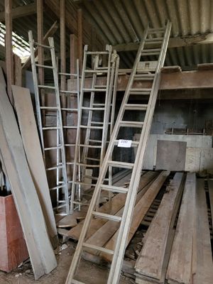 many pieces of wood stacked on top of each other in a room
