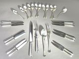 a lot of spoons and forks arranged in a circle