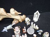 many figurines that are sitting on a black surface