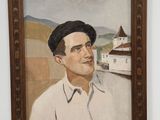 portrait of a man in a beret in a wooden frame on a shelf